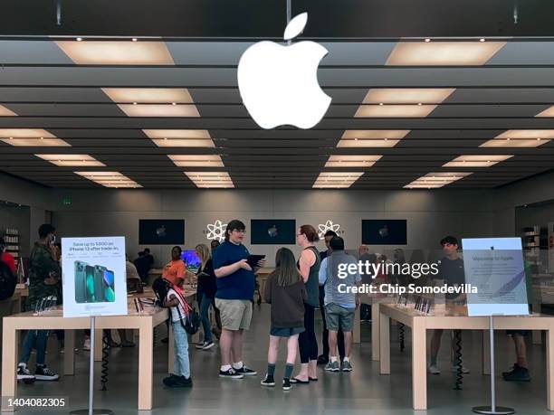 Customers shop at The Apple Store at the Towson Town Center mall, the first of the company's retail locations in the U.S. Where workers voted over...