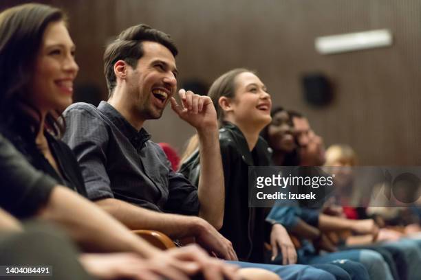group of people in the movie theater - stand up comedy stockfoto's en -beelden