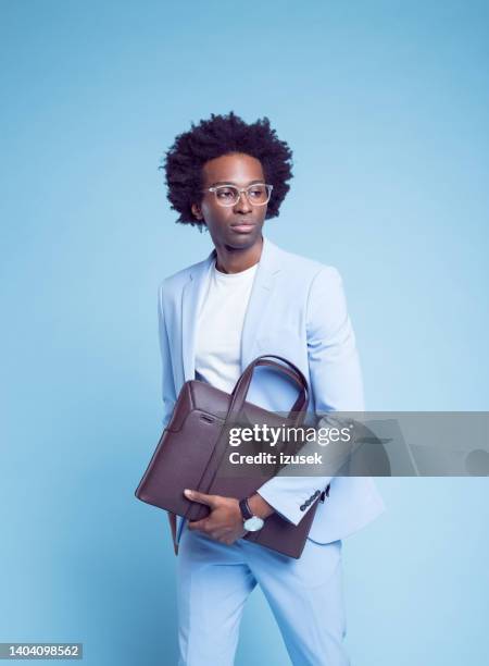 contemplative businessman with briefcase - briefcase isolated stockfoto's en -beelden