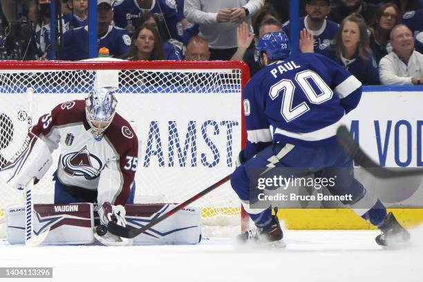 Darcy Kuemper of the Colorado Avalanche makes a save against Nicholas Paul of the Tampa Bay Lightning during the first period in Game Three of the...