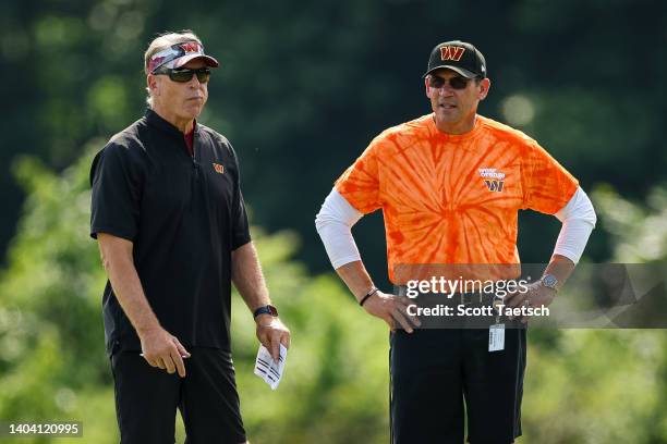 Defensive coordinator Jack Del Rio and head coach Ron Rivera of the Washington Commanders monitor players during the organized team activity at INOVA...