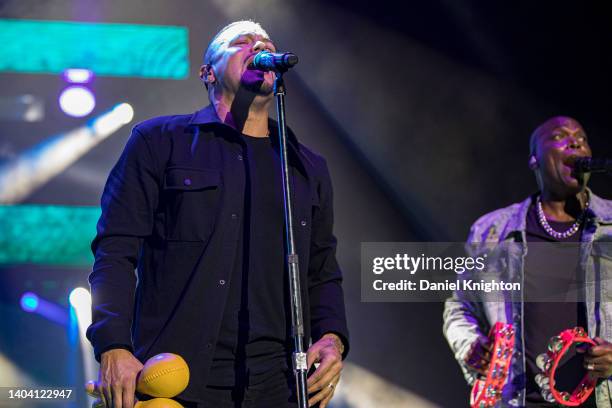 Vocalists Andy Vargas and Ray Greene of Santana perform on stage at North Island Credit Union Amphitheatre on June 17, 2022 in Chula Vista,...