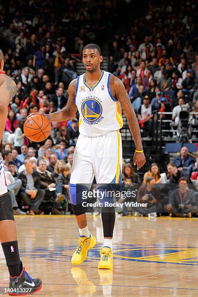Dorell Wright of the Golden State Warriors handles the ball against the Los Angeles Clippers on February 20, 2012 at Oracle Arena in Oakland,...