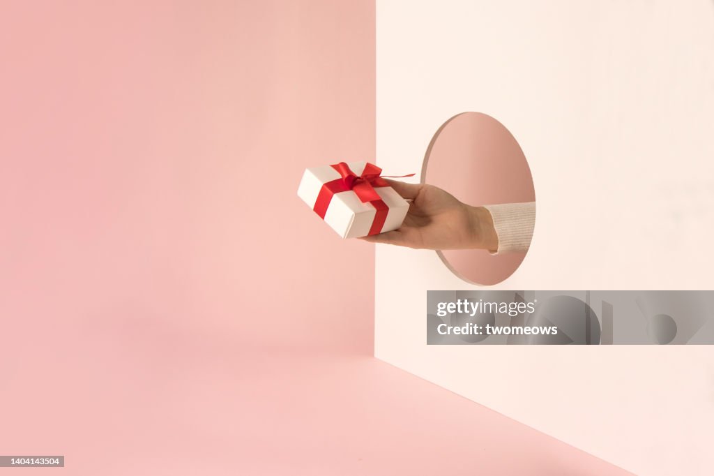 Conceptual rewards still life with gift box.