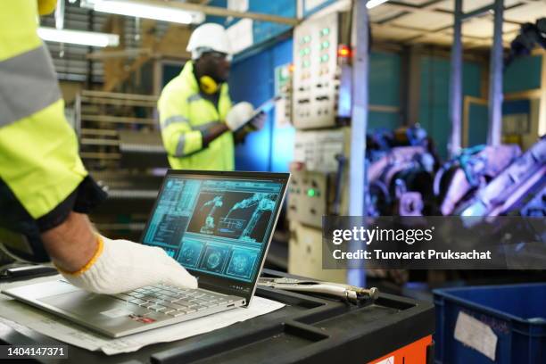 robotic safety checklist audit concepts, engineer working at a factory to design and check quality . discuss parts production in factories, relationship. - train driver stock pictures, royalty-free photos & images