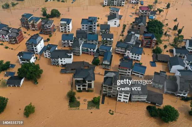 Aerial view of residential houses submerged in flood water on June 21, 2022 in Shangrao, Jiangxi Province of China. China's Jiangxi Province on...