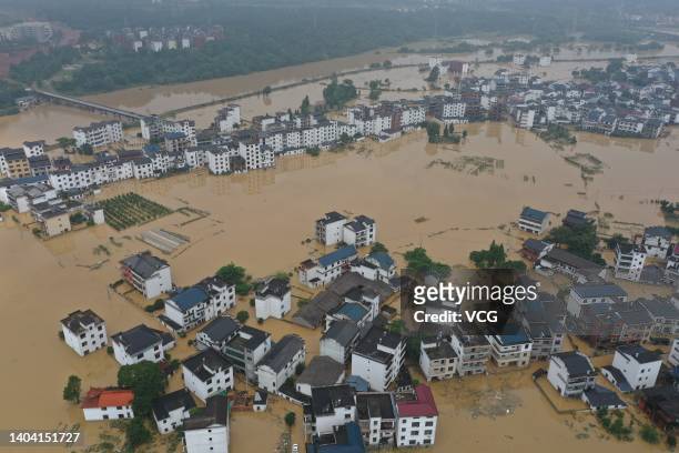 Aerial view of residential houses submerged in flood water on June 21, 2022 in Shangrao, Jiangxi Province of China. China's Jiangxi Province on...