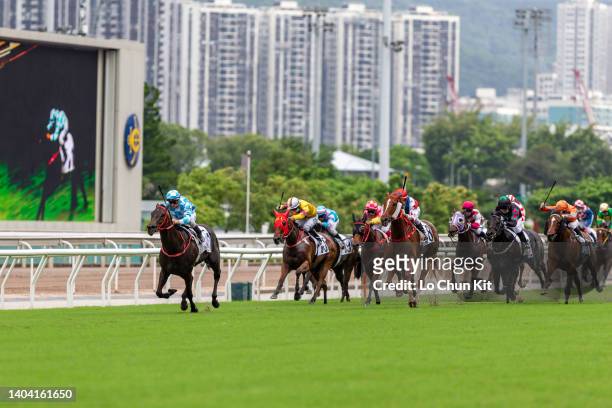 Jockey Zac Purton riding Tuchel wins the Race 8 Lapis Lazuli Handicap at Sha Tin Racecourse on June 19, 2022 in Hong Kong.