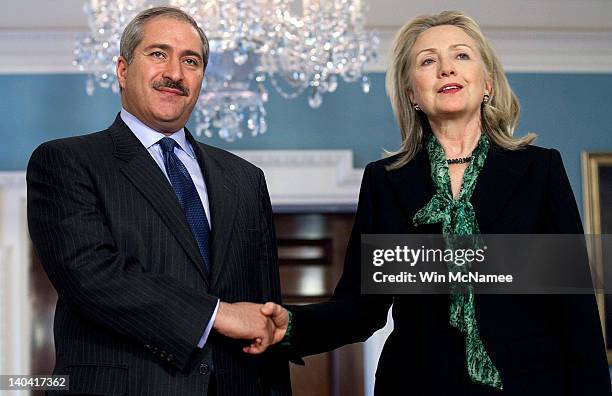 Secretary of State Hillary Clinton shakes hands with Jordanian Foreign Minister Nasser Judeh at the State Department March 2, 2012 in Washington, DC....