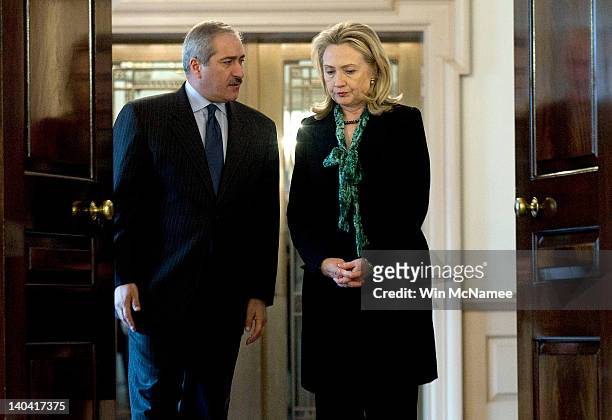 Secretary of State Hillary Clinton walks with Jordanian Foreign Minister Nasser Judeh before making brief remarks at the State Department March 2,...