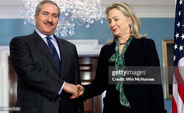 Secretary of State Hillary Clinton shakes hands with Jordanian Foreign Minister Nasser Judeh at the State Department March 2, 2012 in Washington, DC....