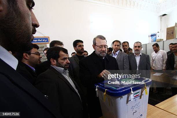 Iranian Parliament Speaker Ali Larijani casts his vote in a polling station at the Massoumeh shrine on March 2, 2012 in the religious city 130 kms...