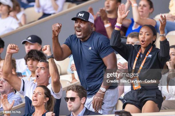 Candi Gauff, and Corey Gauff, parents of Coco Gauff of the United States and her coach Diego Moyano celebrate a break against Martina Trevisan of...