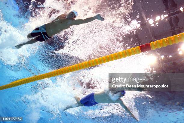 David Popovici of Team Romania and Andrej Barna of Team Serbia compete in the Men's 100m Freestyle heats on day four of the Budapest 2022 FINA World...