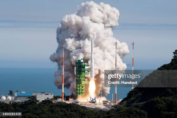 In this handout image provided by Korea Aerospace Research Institute, a space rocket Nuri taking off from its launch pad at the Naro Space Center on...