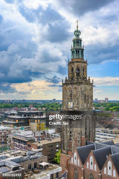 groningen martini tower city skyline panoramic view with a dramatic sky above - groningen city stock pictures, royalty-free photos & images