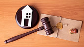 gavel and toy house. law judge contract court legal trust legacy stamp