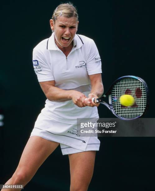 Anke Huber from Germany keeps her eye on the tennis ball playing a double handed backhand return against Louise Latimer of Great Britain during their...
