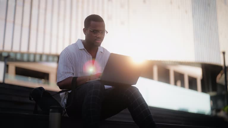 Black Figure Using Computer Young Black Man Using Laptop Videos and HD Footage - Getty Images