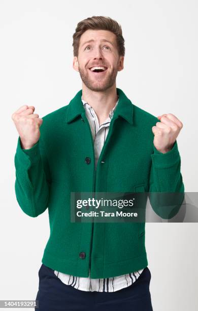 man celebrating - smart casual white background stock pictures, royalty-free photos & images