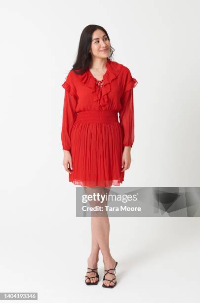 woman looking to side - red dress stock pictures, royalty-free photos & images