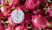 Dragon fruit that has been cut in half for product display. dragon fruit which are beautifully arranged in baskets to prepare for export sale.