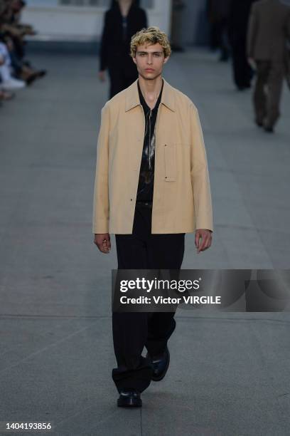 Model walks the runway during the Zegna Ready to Wear Spring/Summer 2023 fashion show as part of the Milan Men Fashion Week on June 20, 2022 in...