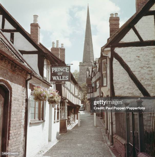 The Prince of Wales pub on Church Lane in the market town of Ledbury near Hereford in Herefordshire, England circa 1965. In the background stands St...