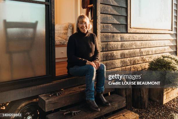 senior female starts her day in her tiny home - farmer female confident stock pictures, royalty-free photos & images