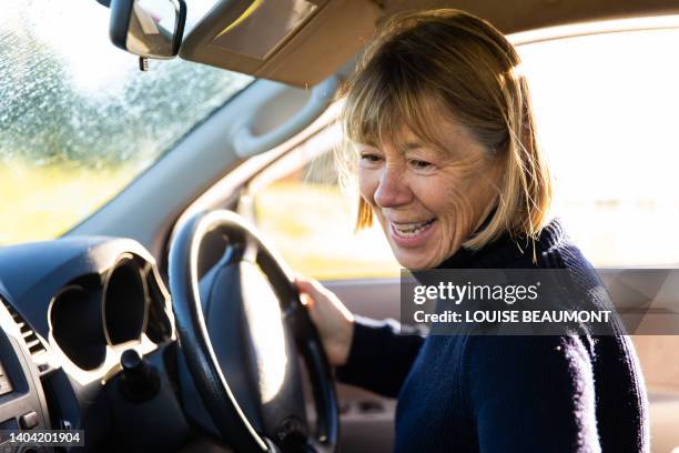 senior female driving her farm car - farmers australia stock pictures, royalty-free photos & images