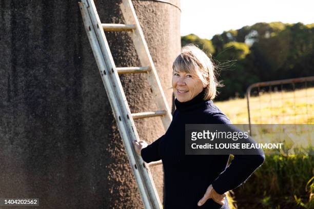 portrait of a senior female farmer - water tower storage tank stock pictures, royalty-free photos & images