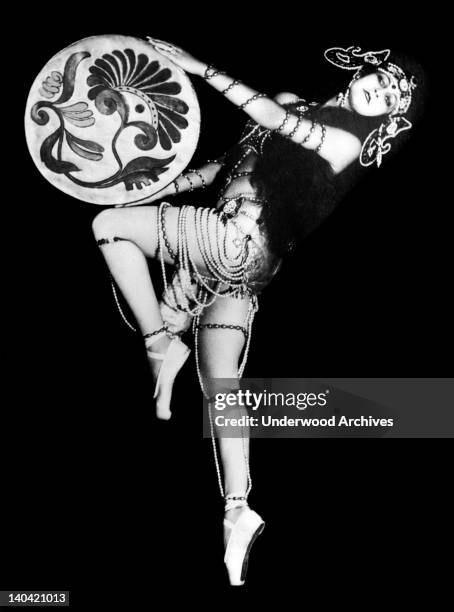 Beautiful Russian dancer Eugenie Nikitine dancing one of her own creations and she is scoring a tremendous hit in Italy, December 3, 1927.