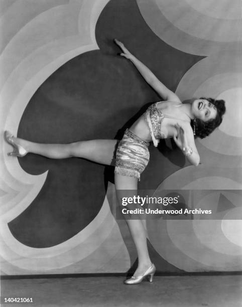 Actress Nancy Carroll demonstrates her backward high kick in high heels as she is acting in the film The Shopworn Angel' in Hollywood, California...