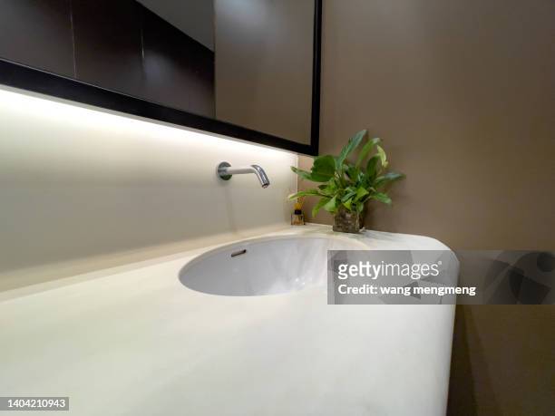 washstand in the bathroom - bathroom sink stock-fotos und bilder