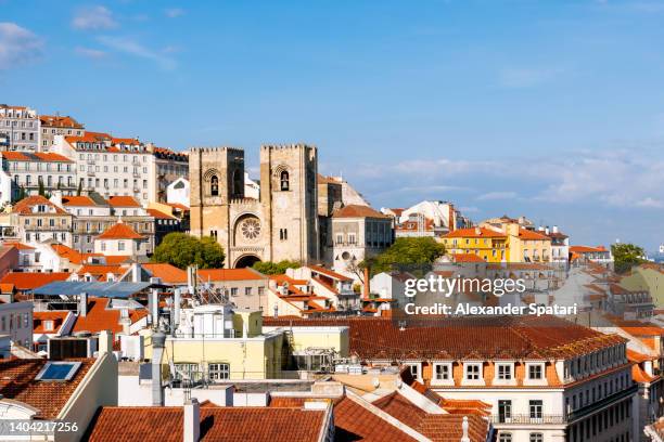 lisbon skyline with lisbon cathedral and alfama rooftops, portugal - tourism in lisbon stock pictures, royalty-free photos & images