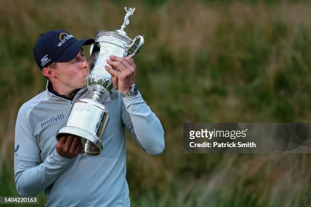 Matt Fitzpatrick of England kisses the U.S. Open Championship trophy after winning during the final round of the 122nd U.S. Open Championship at The...
