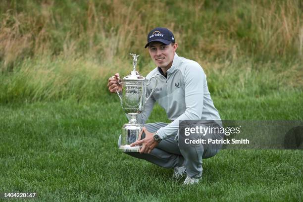 Matt Fitzpatrick of England celebrates with the U.S. Open Championship trophy after winning during the final round of the 122nd U.S. Open...