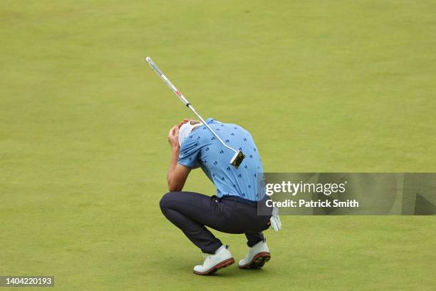 Will Zalatoris of the United States reacts to his missed putt for birdie on the 18th green during the final round of the 122nd U.S. Open Championship...