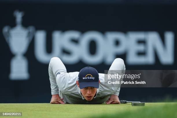 Matthew Fitzpatrick of England lines up a putt on the sixth green during the final round of the 122nd U.S. Open Championship at The Country Club on...
