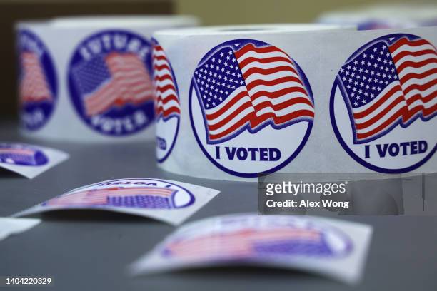 Voted" stickers are seen at a polling station at Rose Hill Elementary School during the midterm primary election on June 21, 2022 in Alexandria,...