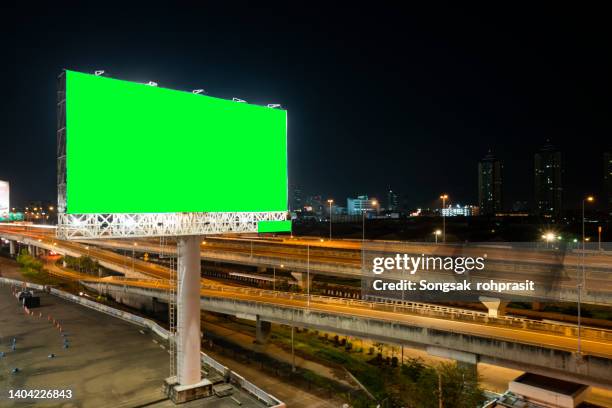 blank billboard for outdoor advertising poster on the highway - billboard highway stock-fotos und bilder