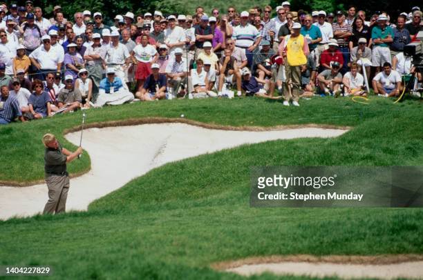 John Daly from the United States chips out of the sand bunker the 96th US Open Golf Championship on 13th June 1996 at the South Course of Oakland...