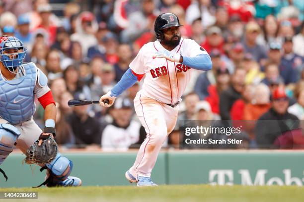 Jackie Bradley Jr. #19 of the Boston Red Sox swings at a pitch during the seventh inning against the St. Louis Cardinals at Fenway Park on June 19,...