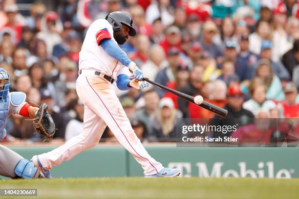 Jackie Bradley Jr. #19 of the Boston Red Sox swings at a pitch during the seventh inning against the St. Louis Cardinals at Fenway Park on June 19,...