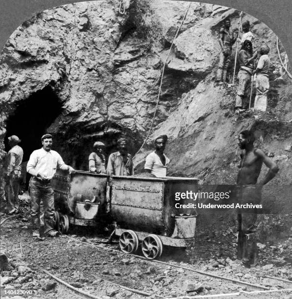 Native black workers taking out the diamondferous blue earth that contains the diamonds in a mine at Kimberley in South Africa, circa 1900.