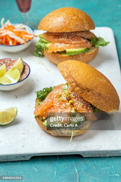 sandwich with salmon fillet and avocado - rustic salmon fillets stock pictures, royalty-free photos & images