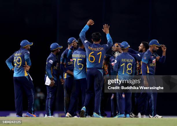 Sri Lankan players celebrate after dismissing David Warner of Australia during the 4th match in the ODI series between Sri Lanka and Australia at R....