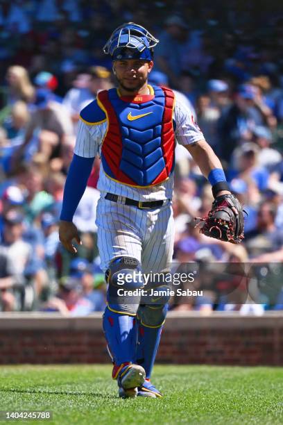 Catcher Willson Contreras of the Chicago Cubs walks off the field to the dugout during a game against the Atlanta Braves at Wrigley Field on June 18,...
