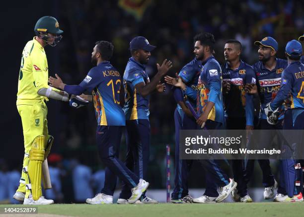 Kusal Mendis of Sri Lanka is congratulated by Josh Hazlewood of Australia after winning the match lead 2-0 in the series during the 4th match in the...