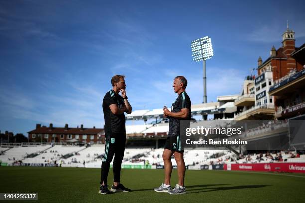 Surrey Interim Head Coach Gareth Batty speaks with Surrey Director of Cricket Alec Stewart ahead of the Vitality T20 Blast match between Surrey and...